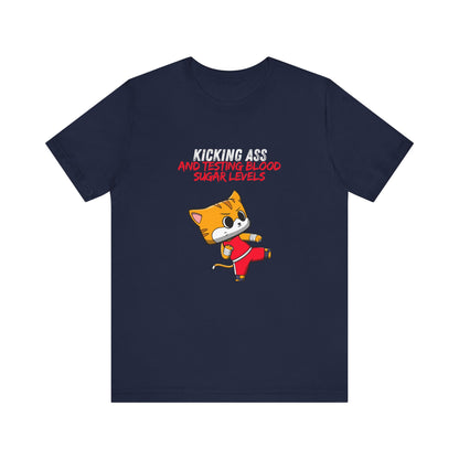 The Diabuddies Store Kicking Ass and Testing Blood Sugar Levels - Unisex Tee Kicking Ass and Testing Blood Sugar Levels - Unisex Tee: This tee is for anyone who faces their daily diabetes routine with a fighting spirit and a good dose of humor. T-Shirts $