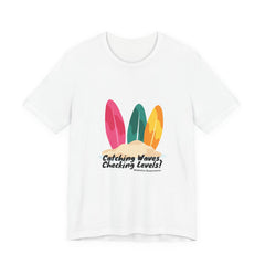 The Diabuddies Store Catching Waves, Checking Levels (Surf Boards) - Unisex Tee Hit the beach or the studio in comfort with our "Catching Waves, Checking Levels..." tee, designed for everyone, including those managing diabetes. T-Shirt Awareness clothing,