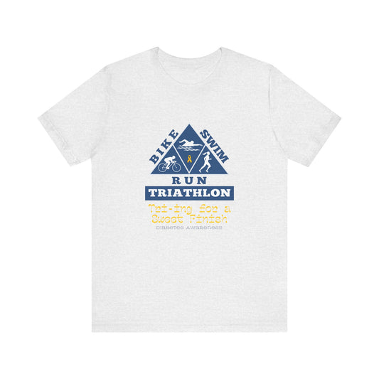 The Diabuddies Store Diabetes & Triathlon - Unisex Tee Diabetes & Triathlon - Unisex Tee: The "Tri-ing for a Sweet Finish" slogan is a powerful nod to both your athletic goals and your journey with diabetes. It's about achieving victory on your own terms.