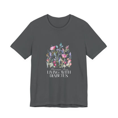 The Diabuddies Store Blossoming Strong, Living with Diabetes. - Unisex Tee Blossoming Strong, Living with Diabetes. - Unisex Tee: Wear your strength proudly! Our "Blossoming Strong, Living with Diabetes" Unisex Tee is a beautiful reminder of your inner po