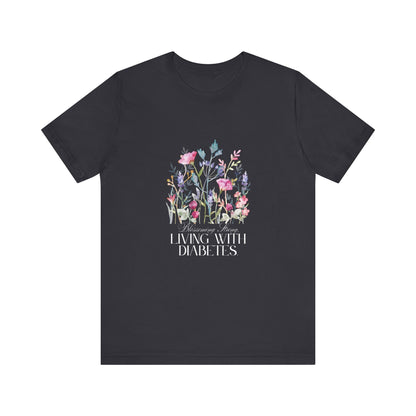The Diabuddies Store Blossoming Strong, Living with Diabetes. - Unisex Tee Blossoming Strong, Living with Diabetes. - Unisex Tee: Wear your strength proudly! Our "Blossoming Strong, Living with Diabetes" Unisex Tee is a beautiful reminder of your inner po