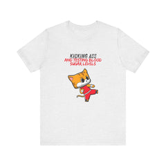 The Diabuddies Store Kicking Ass and Testing Blood Sugar Levels - Unisex Tee Kicking Ass and Testing Blood Sugar Levels - Unisex Tee: This tee is for anyone who faces their daily diabetes routine with a fighting spirit and a good dose of humor. T-Shirts $