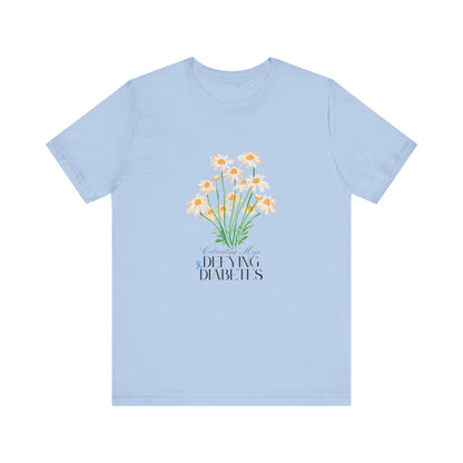The Diabuddies Store Cultivating Hope, Defying Diabetes - Unisex Tee Cultivating Hope, Defying Diabetes - Unisex Tee: Wear your message of strength! Our "Cultivating Hope, Defying Diabetes" Unisex Tee is more than just a comfortable shirt; it's a powerful