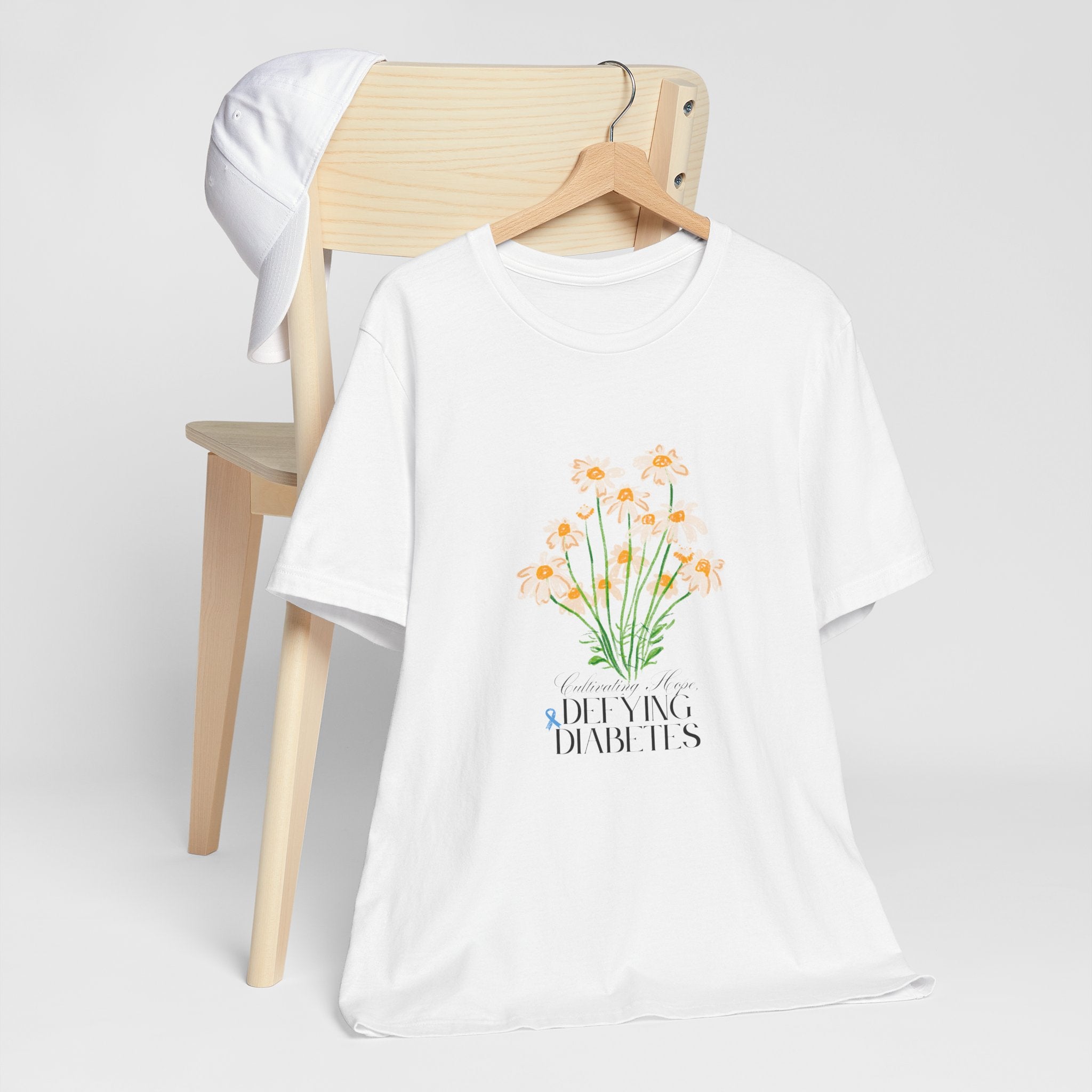 The Diabuddies Store Cultivating Hope, Defying Diabetes - Unisex Tee Cultivating Hope, Defying Diabetes - Unisex Tee: Wear your message of strength! Our "Cultivating Hope, Defying Diabetes" Unisex Tee is more than just a comfortable shirt; it's a powerful