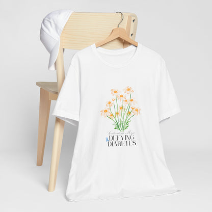 The Diabuddies Store Cultivating Hope, Defying Diabetes - Unisex Tee Cultivating Hope, Defying Diabetes - Unisex Tee: Wear your message of strength! Our "Cultivating Hope, Defying Diabetes" Unisex Tee is more than just a comfortable shirt; it's a powerful