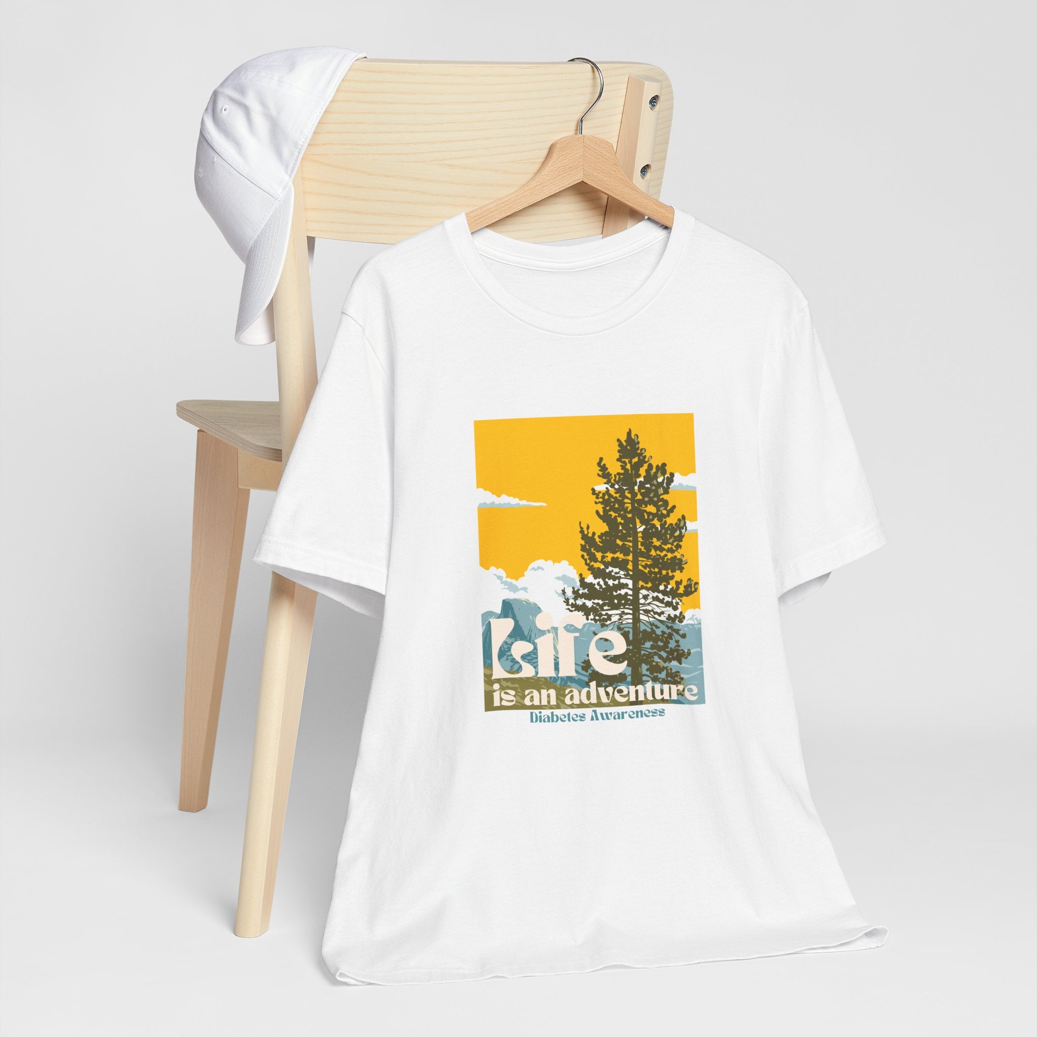 The Diabuddies Store Life is an Adventure, Nature - Unisex Tee Life is an Adventure, Nature - Unisex Tee: Embrace the call of the wild with our "Life is an adventure" Unisex Tee. This shirt is for anyone who finds their soul in the great outdoors, from mo