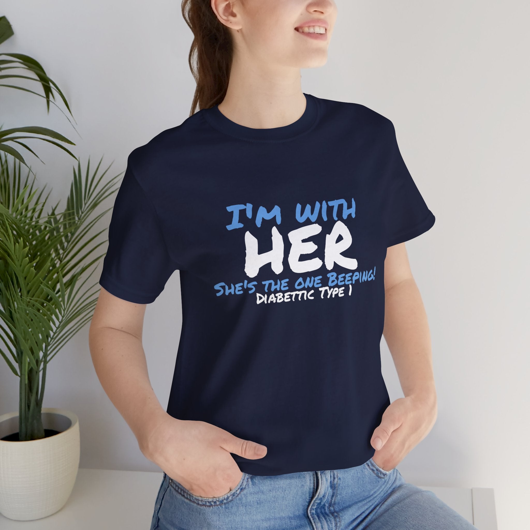 The Diabuddies Store I'm with her, she's the one beeping - Unisex Tee I'm with her, she's the one beeping - Unisex Tee: Show your solidarity with the one who keeps things running (and beeping!) with this fun and comfy tee. Perfect for anyone who supports