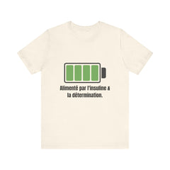The Diabuddies Store Powered By Insulin (French) - Unisex Tee Powered By Insulin (French) - Unisex Tee: Wear your power with pride! Our "Alimenté par l'insuline et la détermination" Unisex Tee is a bold, comfortable statement of strength and gratitude. T-