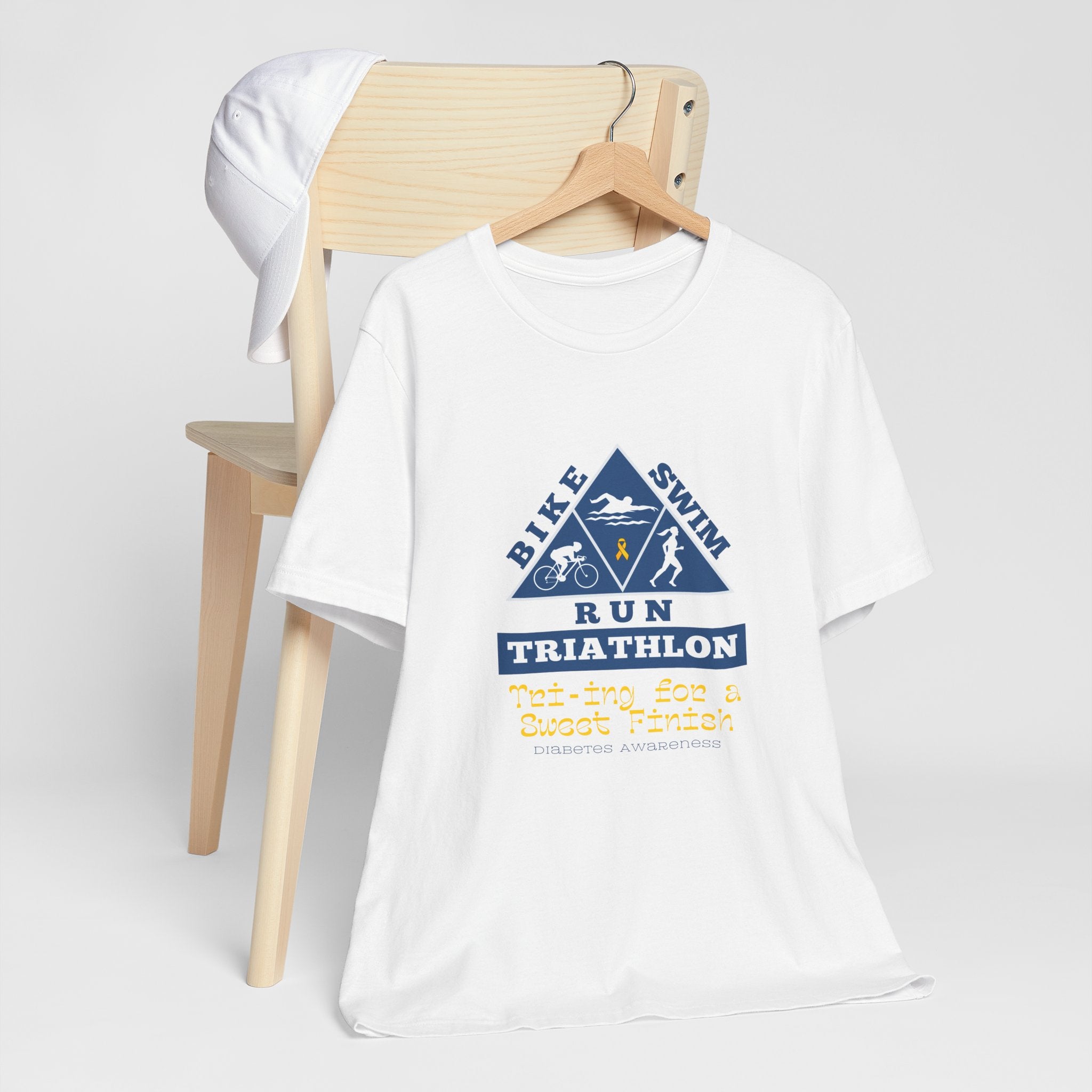 The Diabuddies Store Diabetes & Triathlon - Unisex Tee Diabetes & Triathlon - Unisex Tee: The "Tri-ing for a Sweet Finish" slogan is a powerful nod to both your athletic goals and your journey with diabetes. It's about achieving victory on your own terms.