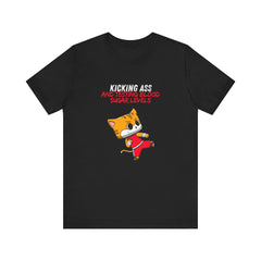 The Diabuddies Store Kicking Ass and Testing Blood Sugar Levels - Unisex Tee Kicking Ass and Testing Blood Sugar Levels - Unisex Tee: This tee is for anyone who faces their daily diabetes routine with a fighting spirit and a good dose of humor. T-Shirts $