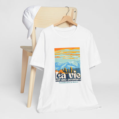 The Diabuddies Store Life is an Adventure, Mountains (French) - Unisex Tee Life is an Adventure, Mountains (French) - Unisex Tee: Embrace the call of the wild with our "La vie est une aventure" Unisex Tee. This shirt is for anyone who finds their soul in