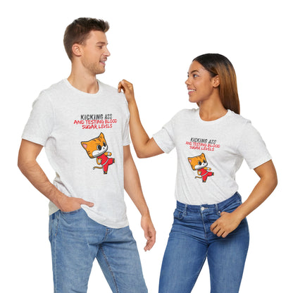 The Diabuddies Store Kicking Ass and Testing Blood Sugar Levels - Unisex Tee Kicking Ass and Testing Blood Sugar Levels - Unisex Tee: This tee is for anyone who faces their daily diabetes routine with a fighting spirit and a good dose of humor. T-Shirts $