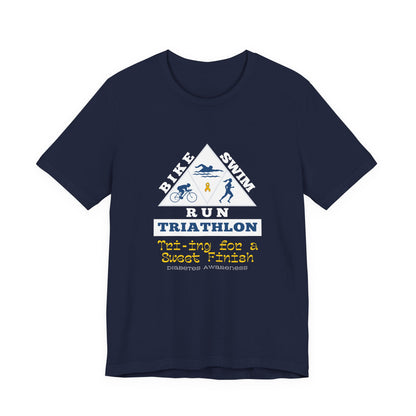 The Diabuddies Store Diabetes & Triathlon - Unisex Tee Diabetes & Triathlon - Unisex Tee: The "Tri-ing for a Sweet Finish" slogan is a powerful nod to both your athletic goals and your journey with diabetes. It's about achieving victory on your own terms.
