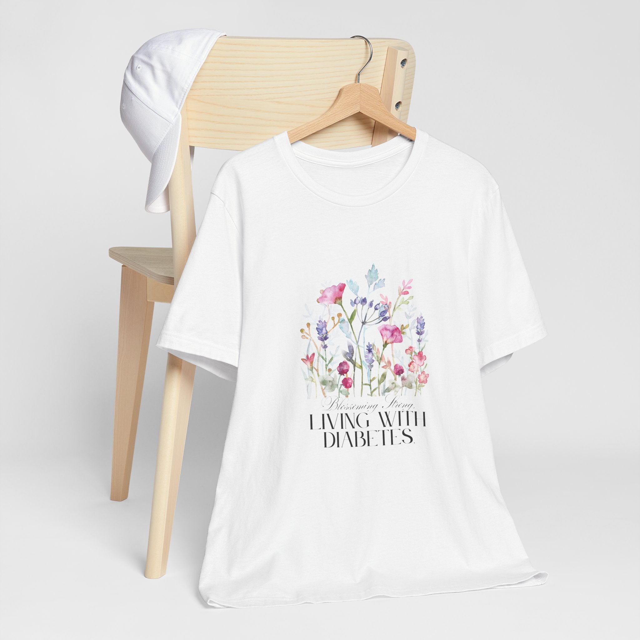 The Diabuddies Store Blossoming Strong, Living with Diabetes. - Unisex Tee Blossoming Strong, Living with Diabetes. - Unisex Tee: Wear your strength proudly! Our "Blossoming Strong, Living with Diabetes" Unisex Tee is a beautiful reminder of your inner po