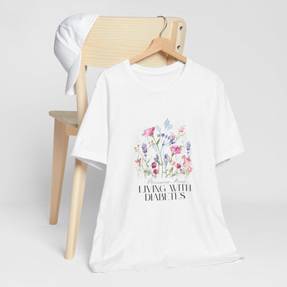 The Diabuddies Store Blossoming Strong, Living with Diabetes. - Unisex Tee Blossoming Strong, Living with Diabetes. - Unisex Tee: Wear your strength proudly! Our "Blossoming Strong, Living with Diabetes" Unisex Tee is a beautiful reminder of your inner po