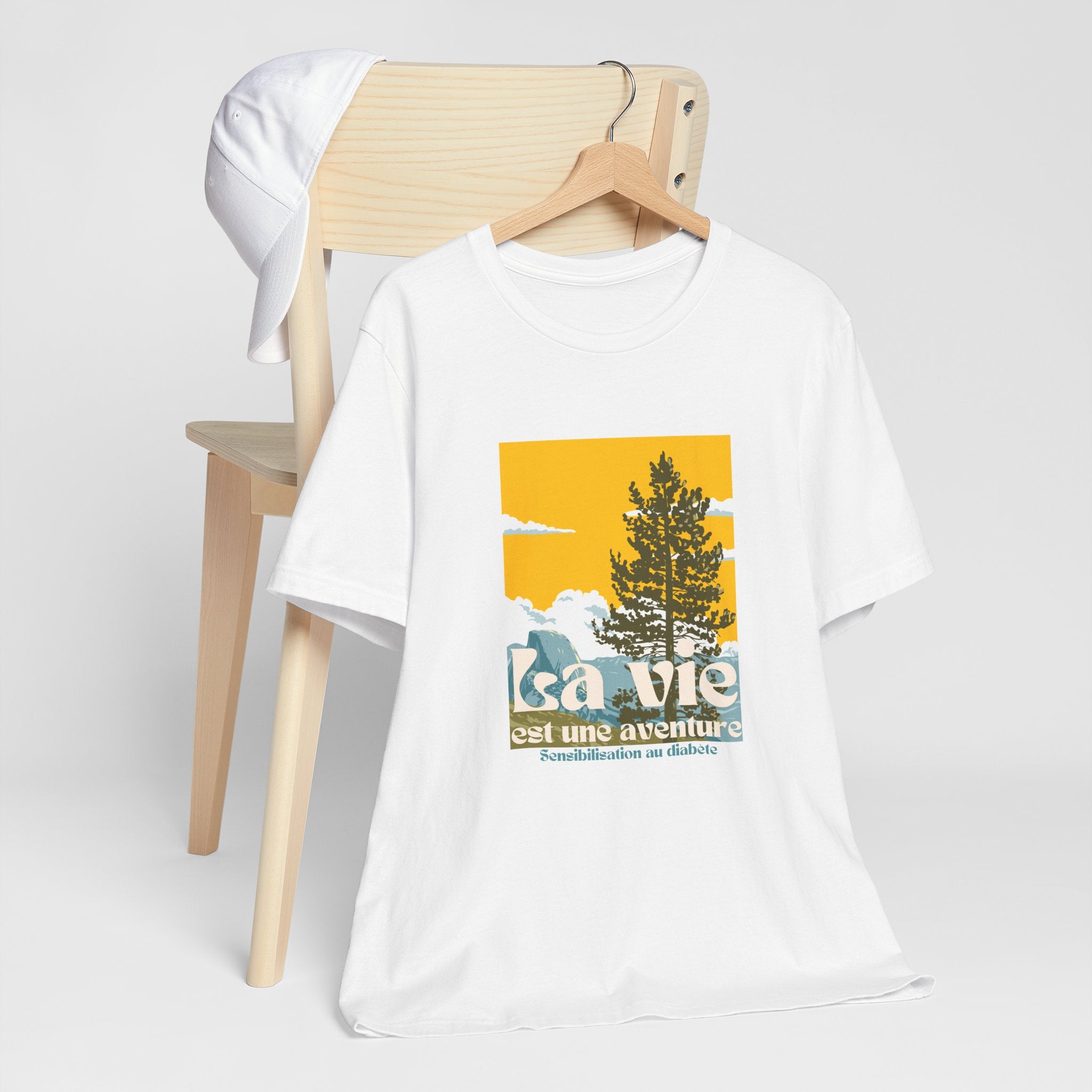 The Diabuddies Store Life is an Adventure, Nature (French) - Unisex Tee Life is an Adventure, Nature (French) - Unisex Tee: Embrace the call of the wild with our "La vie est une aventure" Unisex Tee. This shirt is for anyone who finds their soul in the gr