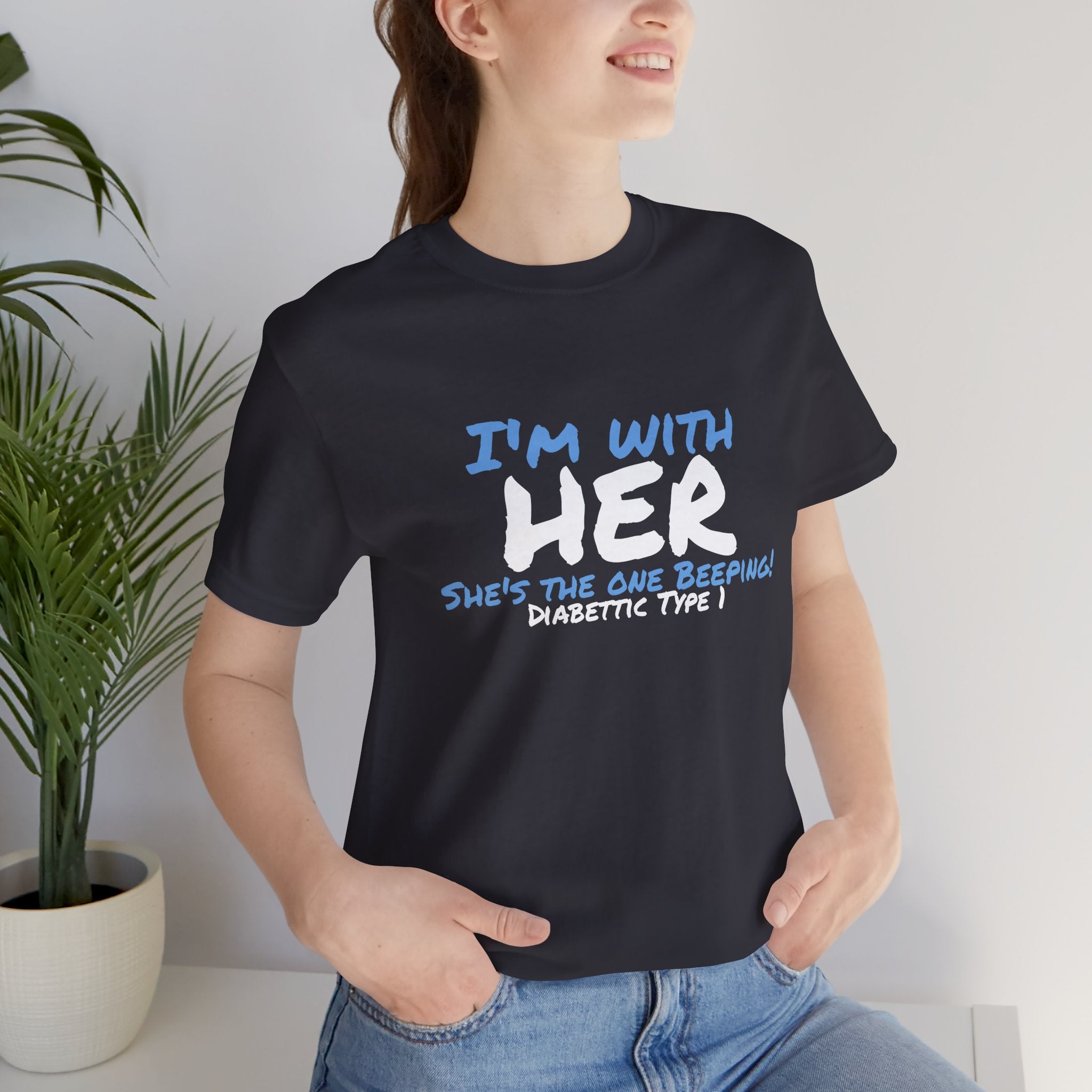 The Diabuddies Store I'm with her, she's the one beeping - Unisex Tee I'm with her, she's the one beeping - Unisex Tee: Show your solidarity with the one who keeps things running (and beeping!) with this fun and comfy tee. Perfect for anyone who supports
